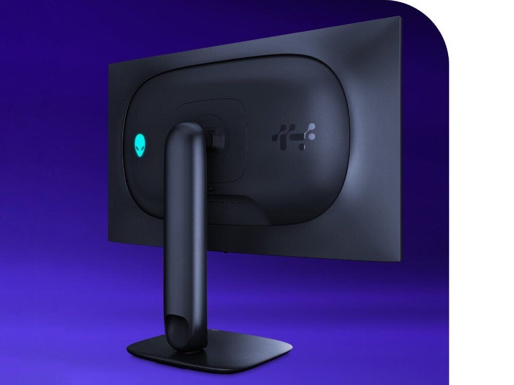 Monitor DELL Alienware AW2725Q Tylna obudowa monitora na fioletowym tle z widocznym owalnym elementem centralnym i podświetlanym logo