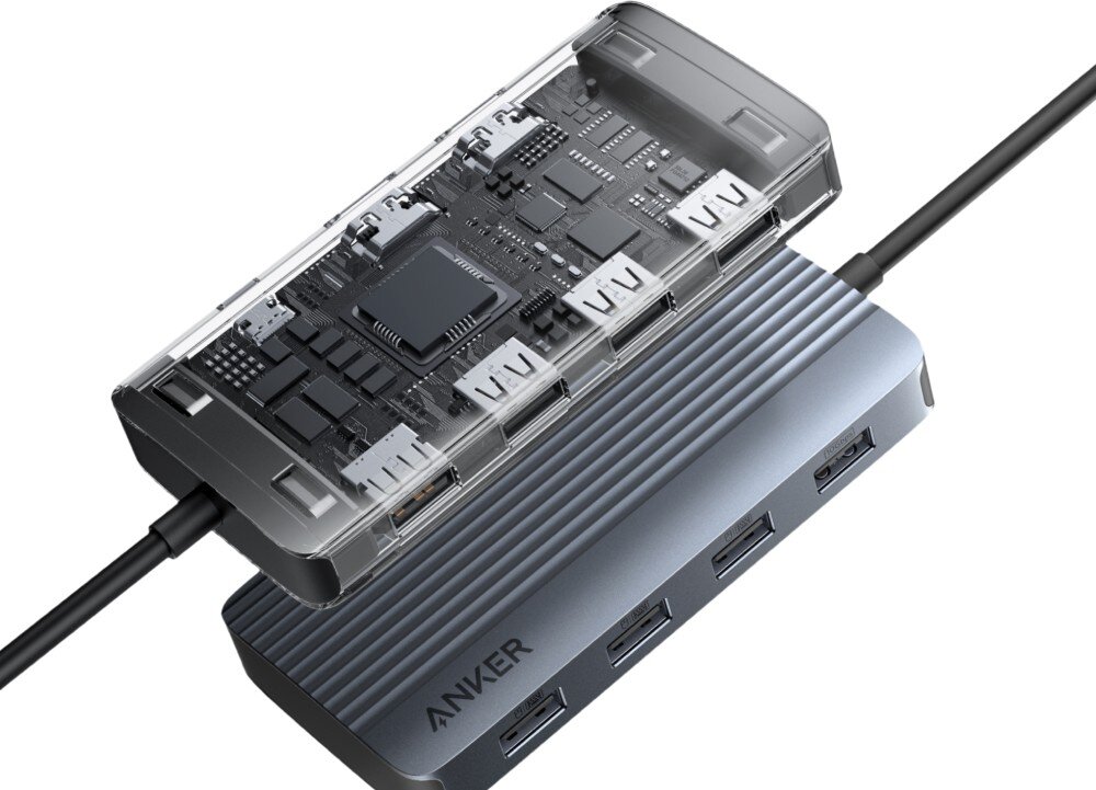 Hub ANKER A83740A1 7w1 Wizualizacja techniczna pokazująca wnętrze huba z widocznymi układami scalonymi i płytką drukowaną na tle jego metalowej obudowy