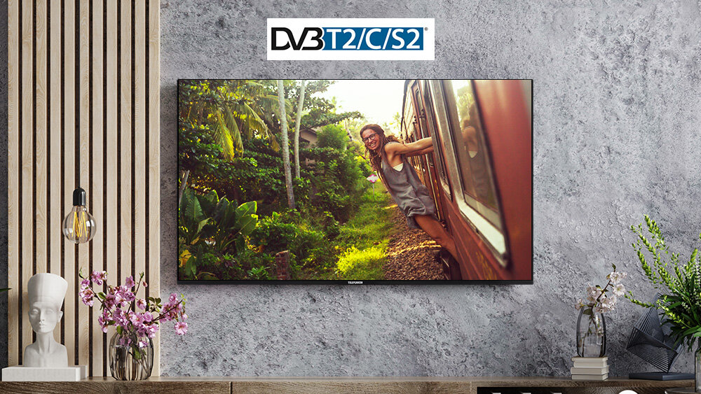 Telewizor TELEFUNKEN TFL-55AEU2000 - Potrójny tuner DVB-T2/C/S2, HEVC H.265, telewizor powieszony na ścienie nad komodą