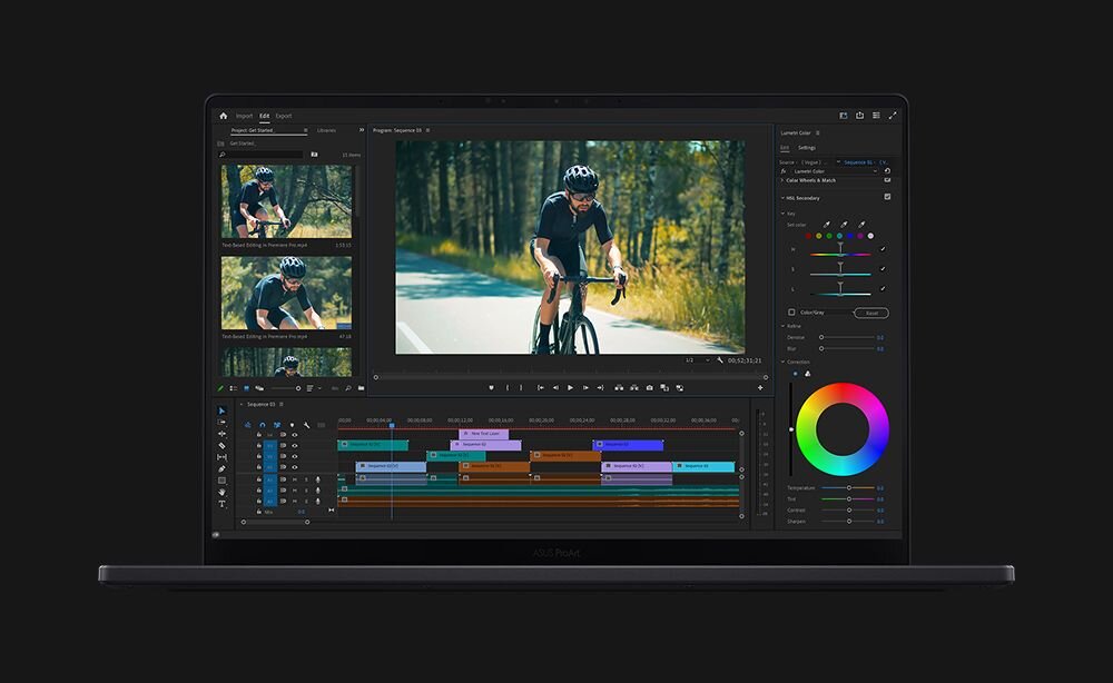 Laptop ASUS ProArt P16 z otwartą aplikacją do edycji wideo pokazującą materiał z kolarzem jadącym przez las, z widoczną osią czasu i kołem kolorów - RAM LPDDR5X