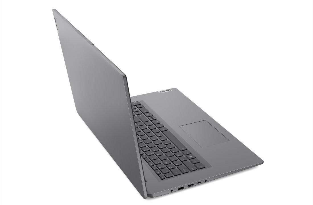 Srebrny laptop z otwartą pokrywą, widoczna klawiatura i touchpad. Na obudowie znajduje się logo \\'Lenovo\\'.