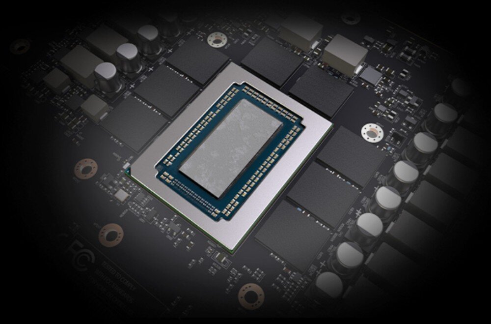 Karta graficzna SAPPHIRE Nitro+ Radeon RX 9060 XT 16GB Zbliżenie na układ scalony karty graficznej z szarym materiałem termoprzewodzącym na procesorze, pasta termoprzewodząca, laminat, aluminiowy backplate