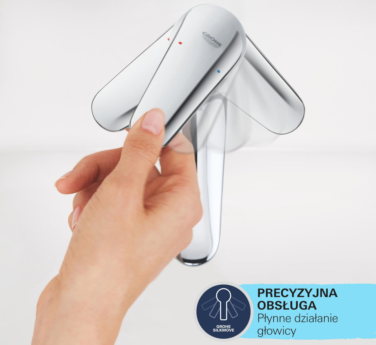 BATERIA UMYWALKOWA GROHE EUROSMART COSMOPOLITAN 23327000 CHROM Na zdjęciu pokazano dłoń regulującą uchwyt baterii, a rozmyte smugi wokół niej ilustrują płynny i precyzyjny zakres ruchu. W prawym dolnym rogu widoczna jest grafika informująca o precyzyjnej obsłudze dzięki technologii ułatwiającej działanie głowicy ceramiczna głowica SilkMove regulacja temperatury płynna dźwignia precyzja