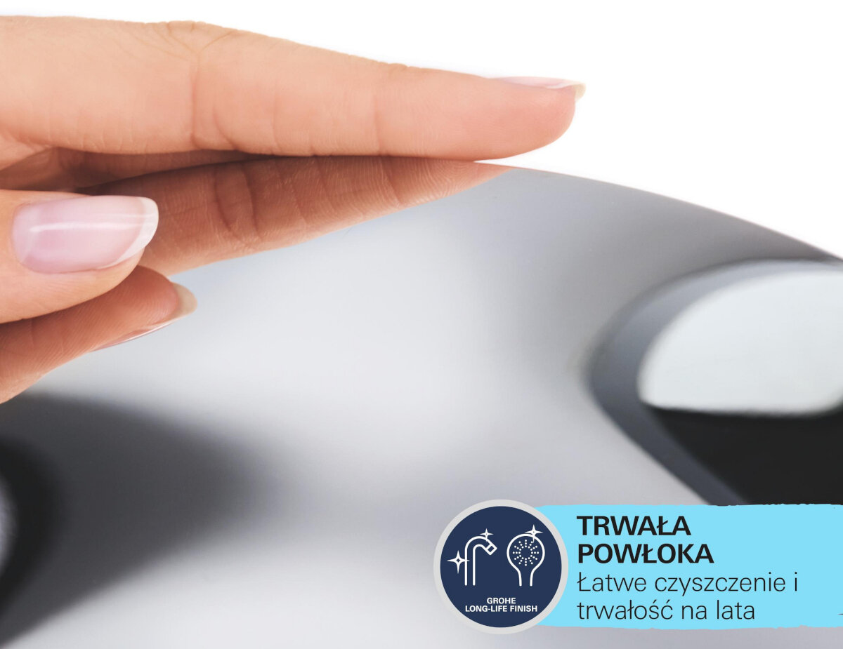 BATERIA WANNOWO-PRYSZNICOWA GROHE EUROCUBE PODTYNKOWA 24062000 CHROM Zdjęcie przedstawia zbliżenie dłoni, która delikatnie dotyka gładkiej, błyszczącej powierzchni o metalicznym wykończeniu. Powierzchnia ma zaokrąglony kształt i wygląda jak element armatury lub urządzenia o połyskującym, chromowanym wykończeniu bateria łazienkowa chromowana elegancka geometryczna odporna łatwa w czyszczeniu