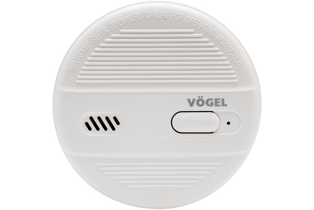 Zdjęcie frontu okrągłego, białego czujnika dymu VÖGEL VSA100 na białym tle. Widoczne logo VÖGEL, podłużny przycisk testu/wyciszenia z napisem PUSH TO TEST WEEKLY, kratki głośnika oraz napisy informacyjne (IMPORTANT: REFER TO OWNERS MANUAL FOR OPERATING INSTRUCTIONS, DO NOT PAINT, ON TWIST OFF).