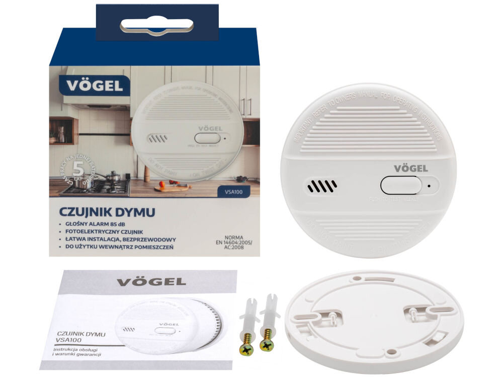 Czujnik dymu VÖGEL VSA100 Kompletny zestaw bezprzewodowego, fotoelektrycznego czujnika dymu VÖGEL VSA100. Widoczne pudełko z informacjami (m.in. CZUJNIK DYMU, GŁOŚNY ALARM 85 dB, norma EN 14604), główna część czujnika, jego płyta montażowa, instrukcja obsługi oraz dwa zestawy kołków i śrub montażowych.