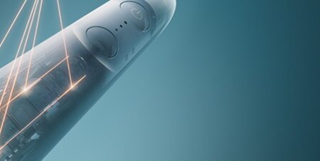 Zbliżenie na wnętrze szczoteczki, z którego roztaczają się laserowe połączenia.