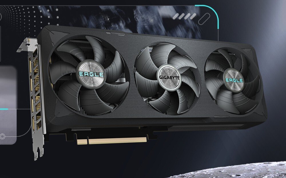 Komputer MAD DOG Powered by Gigabyte AORUS301-I15DR32 Czarna karta graficzna z trzema dużymi wentylatorami. Na środkowym i prawym wentylatorze widnieje napis 'Eagle', a na lewym 'Gigabyte'. W tle ciemna, graficzna kompozycja, karta graficzna, pamięć VRAM, rdzenie CUDA, technologie