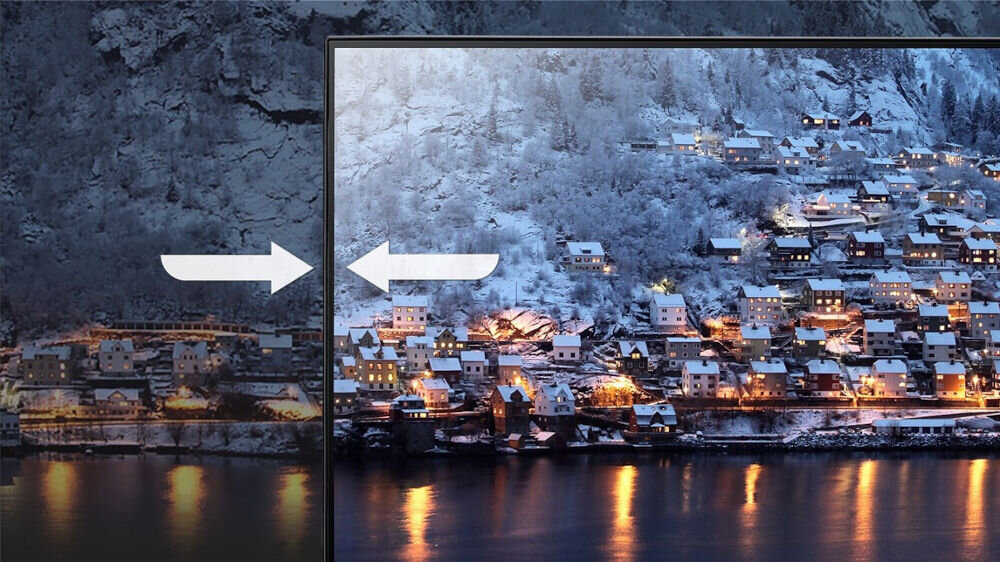 Monitor ACER SA273G0WI 27 cali 1920x1080px IPS 120Hz 1ms [VRB] prezentacja cienkich ramek monitora w tle zimowy krajobraz górski z domkami na wzgórzu przed budynkami woda  smukła obudowa 7,2 mm oszczędność miejsca ZeroFrame