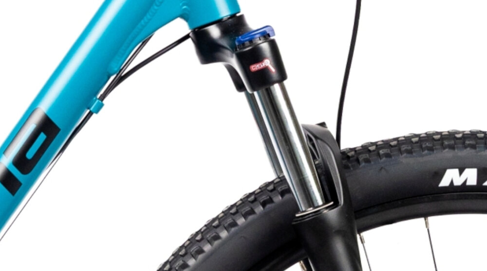 Rower górski MTB INDIANA X-Pulser 3.9 D18 29 cali damski Niebiesko-czarny zbliżenie na amortyzator rower typu hardtail przedni amortyzator marki SUNTOUR typ XCT DS. HLO 29 długość skoku 100 mm ułatwia najeżdżanie na przeszkody niweluje wstrząsy niska masa roweru duża sztywność regulacja za pomocą sprężyny obsługa poprzez pokrętło na goleni