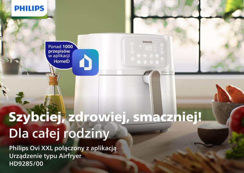 Na obrazie widoczna jest biała frytkownica beztłuszczowa z wyświetlaczem dotykowym, obok której znajdują się warzywa i przyprawy. Tekst na obrazie: \'Szybciej, zdrowiej, smaczniej! Dla całej rodziny Philips Ovi XXL połączony z aplikacją Urządzenie typu Airfryer HD9285/00\'.