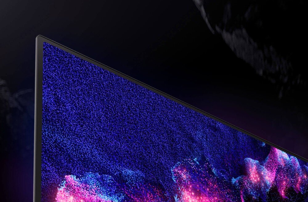 Monitor ASUS ROG Swift PG32UCDM Zbliżenie narożnika ekranu monitora o bardzo cienkiej ramce z wyświetlanym obrazem w odcieniach niebieskiego, różu i fioletu, wygląd, konstrukcja, ramka, regulacja