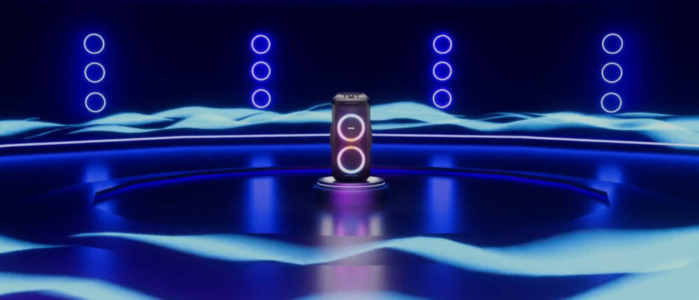 Power Audio TRONSMART Halo 300 240W 111 dB mocny bas czyste tony, power audio stojące na środku pomieszczenia z którego wydobywają się fale dźwiękowe