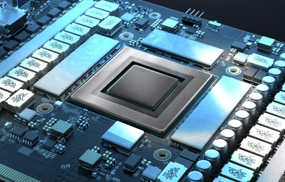 Karta graficzna ASUS TUF Gaming GeForce RTX 5070 Ti White OC Edition 16GB Zbliżenie na rdzeń procesora graficznego otoczony metalową ramką i kondensatorami