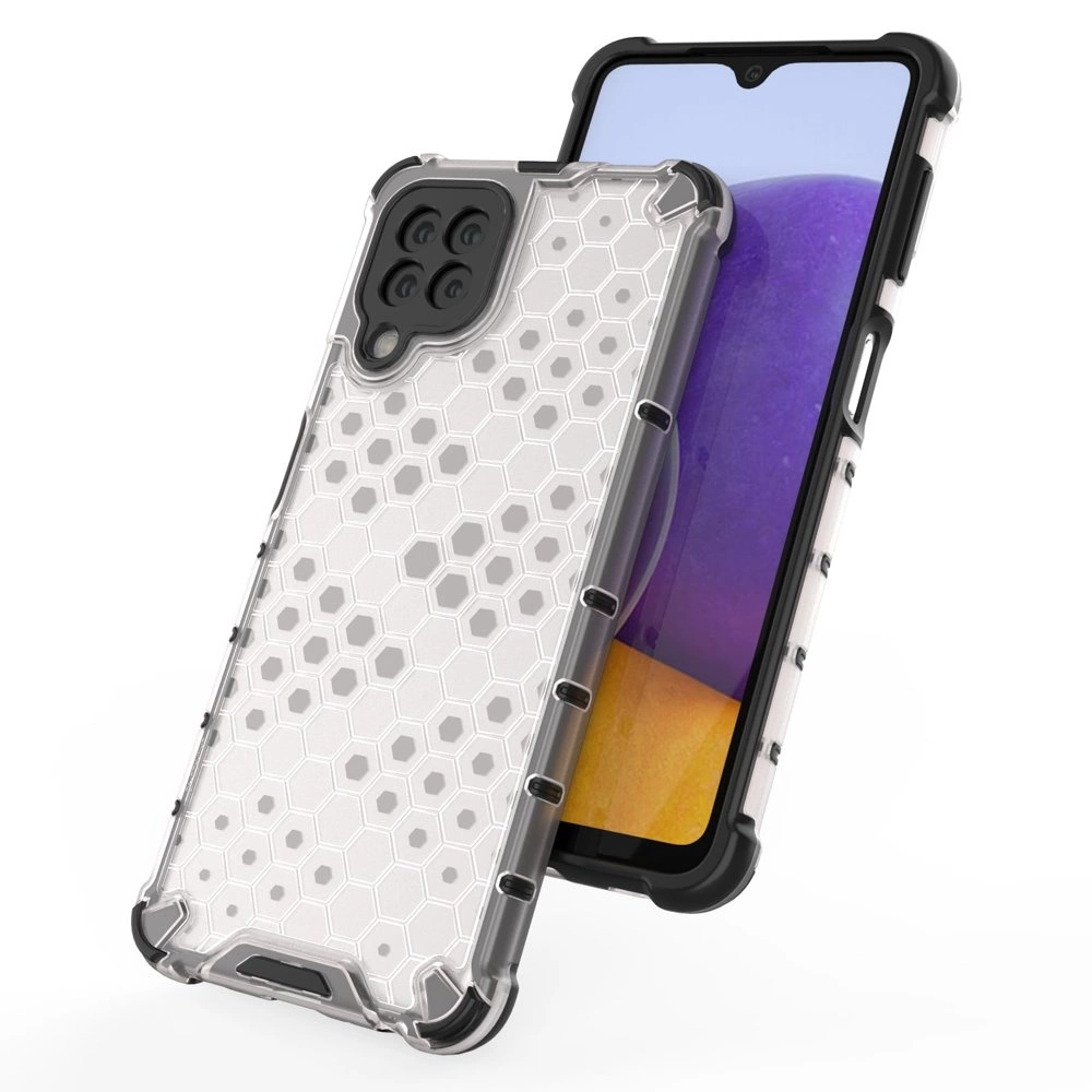 Obraz przedstawia przezroczyste etui na telefon z wzorem plastra miodu i czarnymi wzmocnieniami na rogach. W tle widoczny jest telefon z wyświetlaczem w kolorach fioletowym i żółtym.