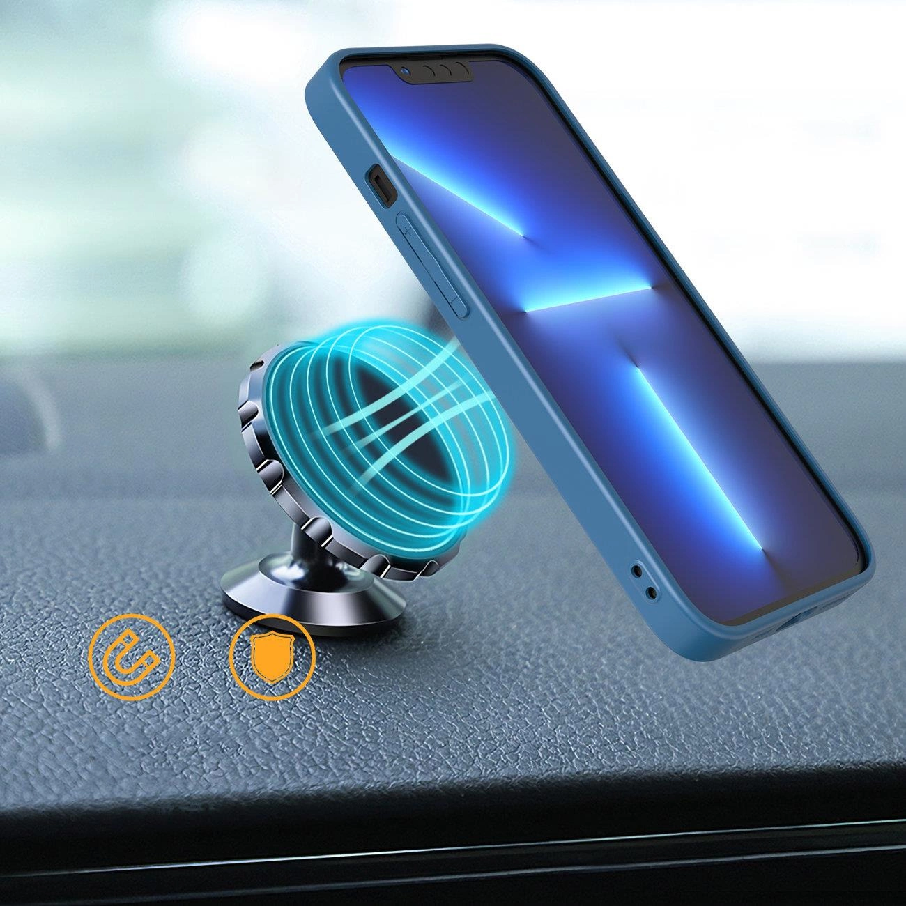 Obraz przedstawia telefon w niebieskim etui zamocowany na magnetycznym uchwycie na desce rozdzielczej. Widać także dwa symbole: magnesu i tarczy ochronnej.
