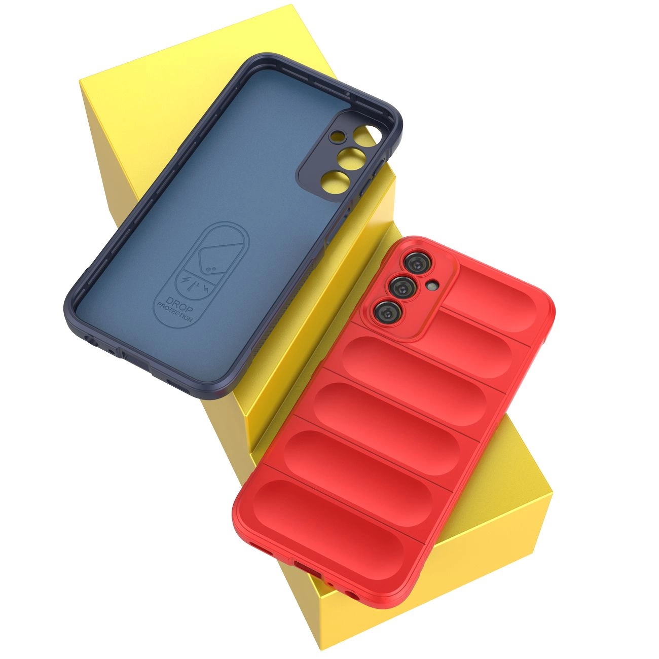 Na obrazie widoczne są dwa etui na telefon, jedno w kolorze niebieskim z napisem \'DROP PROTECTION\', a drugie czerwone z wyraźnymi wypukłościami. Oba etui leżą na żółtych pudełkach.