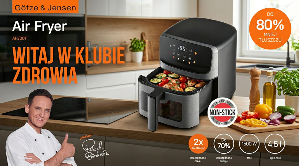 Na obrazie znajduje się frytkownica beztłuszczowa Götze & Jensen AF300T z okienkiem, wypełniona warzywami. Obok widoczny jest napis \'WITAJ W KLUBIE ZDROWIA\' oraz informacje o produkcie, takie jak \'DO 80% MNIEJ TŁUSZCZU\' i \'4,5 l\'.