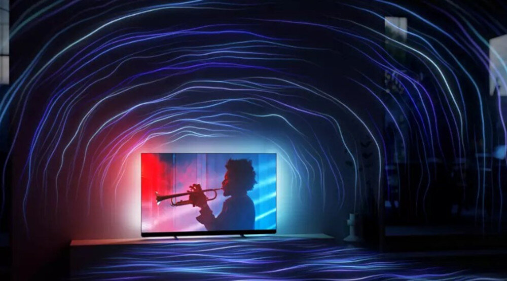 Telewizor PHILIPS 77OLED910 system dźwiękowy Bowers & Wilkins szeroka scena dźwiękowa, telewizor stojący na komodzie w pomieszczeniu