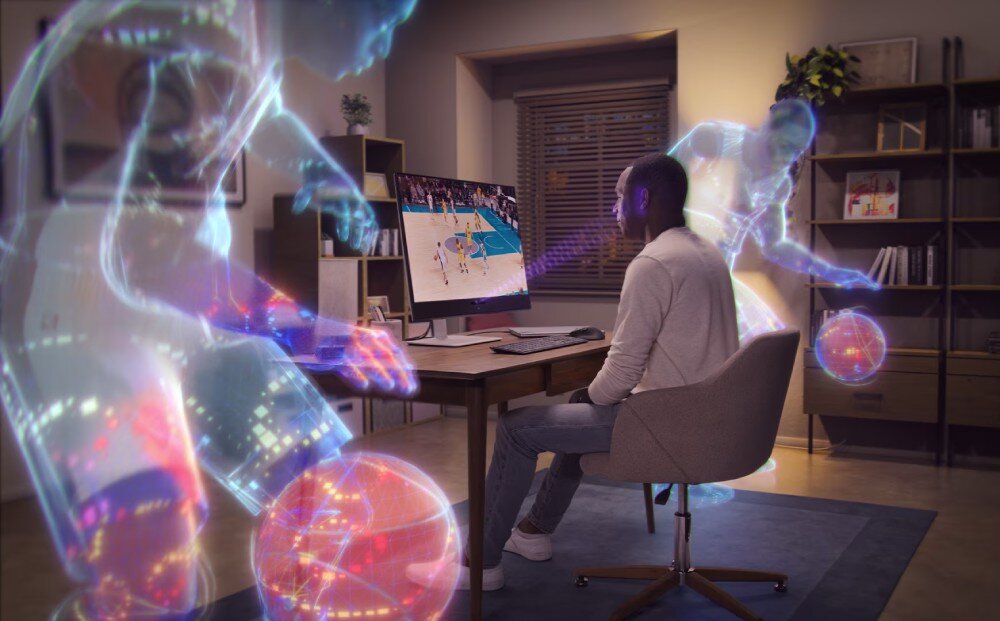 Monitor DELL S3225QC Osoba siedząca przy biurku przed monitorem z nałożonymi graficznymi efektami reprezentującymi dźwięk przestrzenny 3D