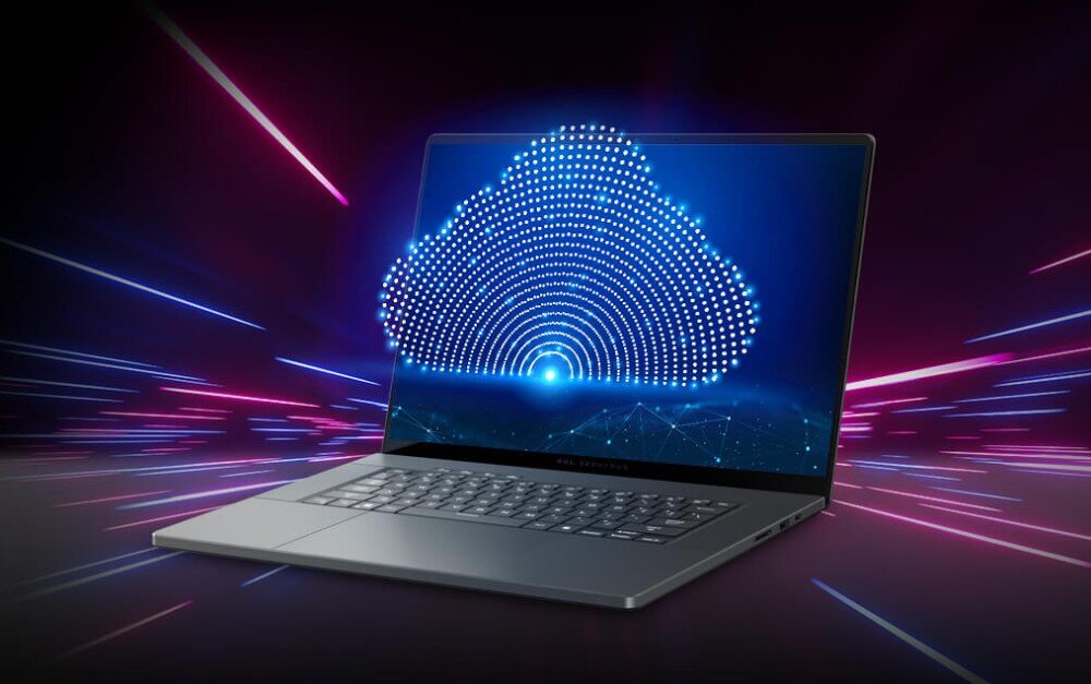 Router ASUS ROG Strix GS-BE18000 Srebrny laptop na ciemnym tle wyświetla na ekranie świecącą chmurę złożoną z wielu jasnych punktów, z kolorowymi smugami światła wybiegającymi na boki, port USB-A, szyfrowanie