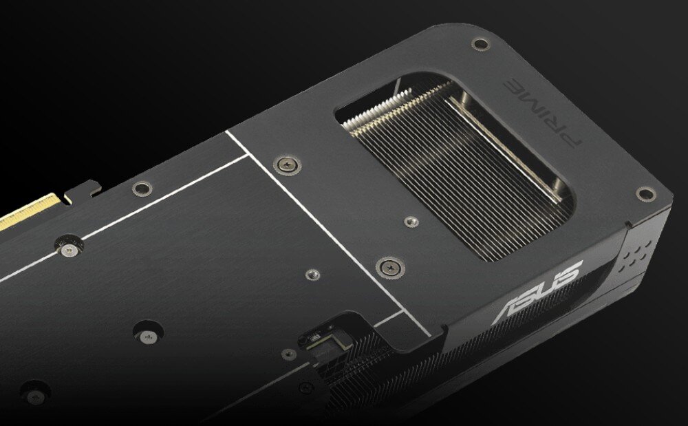 Karta graficzna ASUS Prime Radeon RX 9060 XT OC Edition 16GB Fragment tylnej obudowy karty graficznej z prostokątnym wycięciem ukazującym gęste użebrowanie radiatora