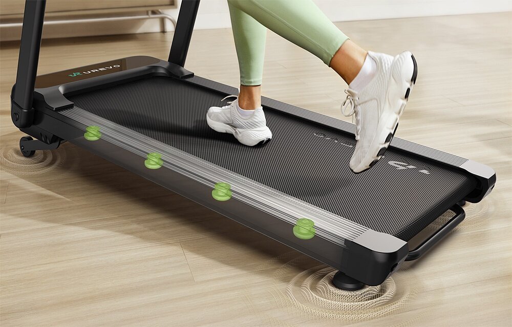 Bieżnia elektryczna UREVO Foldi 3S 560W 12km-h Zbliżenie na pas bieżni i system amortyzacji z zaznaczonymi zielonymi punktami redukującymi wstrząsy podczas biegu kąt nachylenia bieżni w dziewięciu stopniach efektywne spalanie kalorii