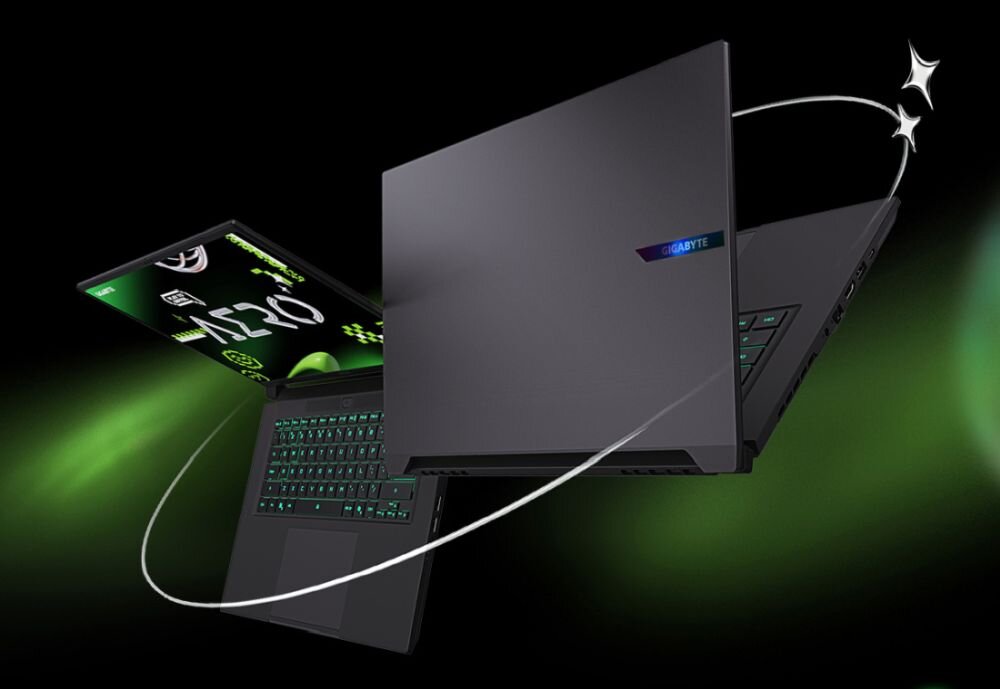Na obrazie widoczny jest laptop z otwartym ekranem i podświetlaną klawiaturą. Na obudowie znajduje się logo \'GIGABYTE\'.