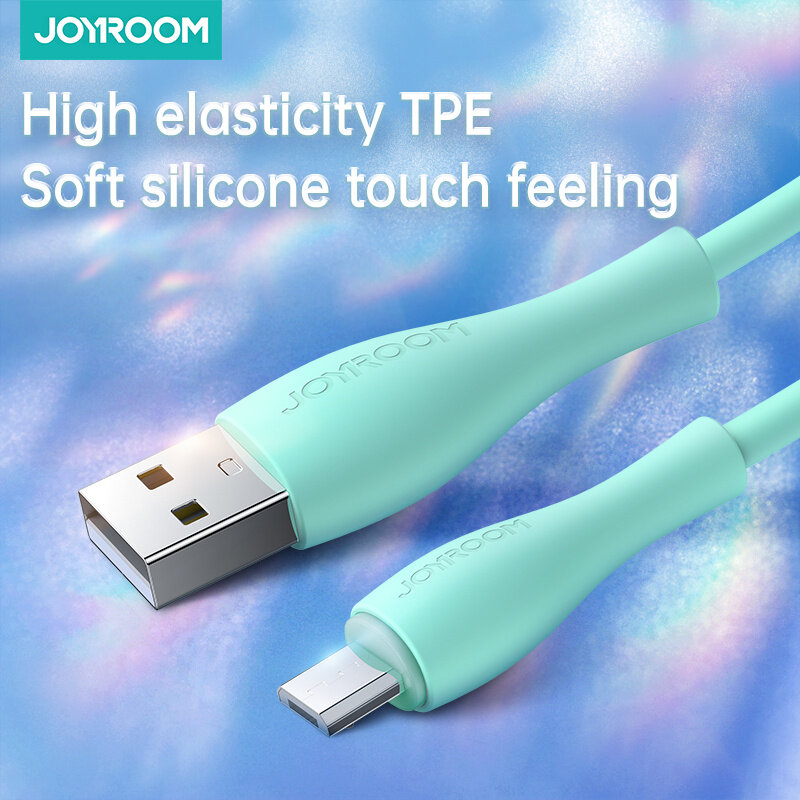 Obraz przedstawia miętowy kabel USB z końcówkami USB i Micro USB, na tle niebiesko-fioletowym. Widoczny jest tekst: \'High elasticity TPE Soft silicone touch feeling\' oraz logo \'JOYROOM\'.