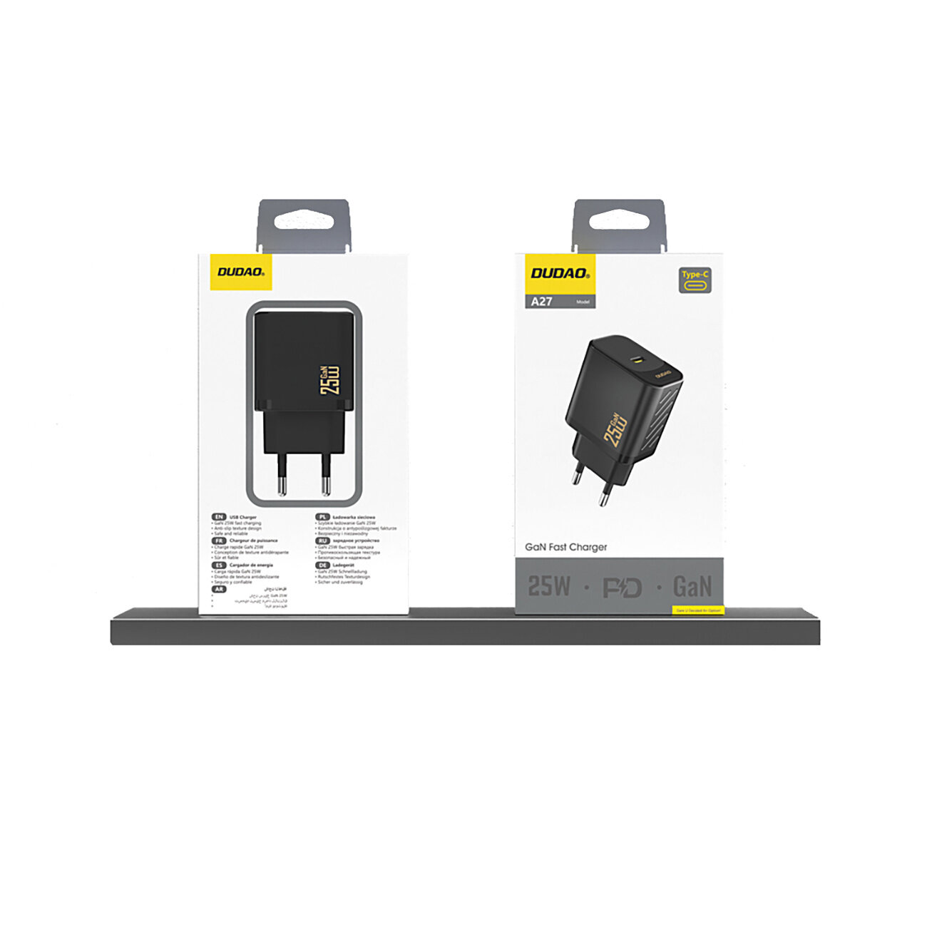 Na obrazie widoczne są dwa opakowania ładowarki sieciowej Dudao A27 25W GAN USB-C w kolorze czarnym, umieszczone na półce. Na opakowaniach znajdują się napisy: \'25W\', \'GaN Fast Charger\', \'PD\', \'GaN\'.
