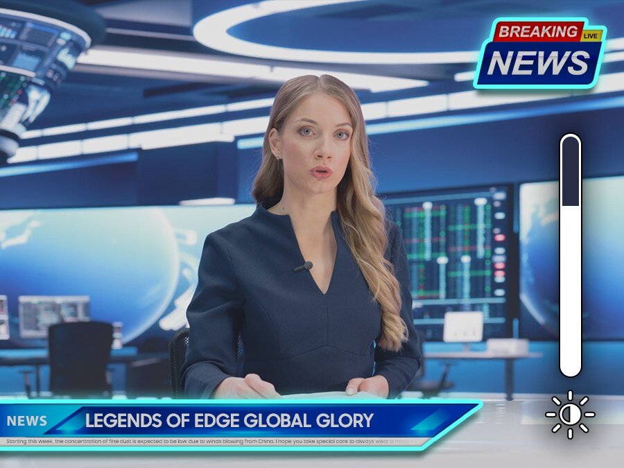 Kobieta w studiu telewizyjnym prowadzi wiadomości, na ekranie widoczny jest napis \'LEGENDS OF EDGE GLOBAL GLORY\'. W prawym górnym rogu znajduje się logo \'BREAKING NEWS\'.