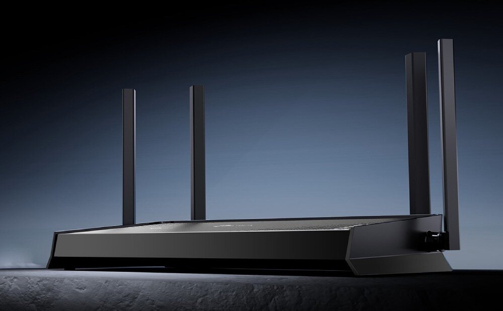 Router TP-LINK Archer BE220 Widok z boku na czarny router z czterema pionowymi antenami ustawiony na płaskiej powierzchni, technologia, rozwiązania, wydajność