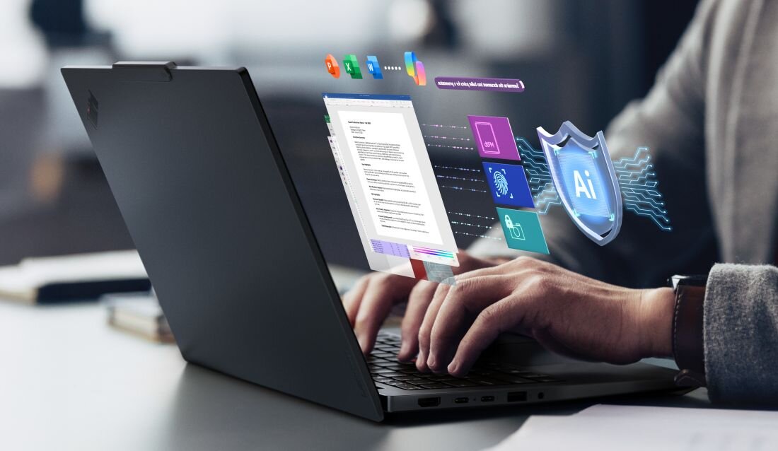 Osoba korzysta z laptopa Lenovo ThinkPad E14 Gen 7 z funkcją logowania biometrycznego podczas pracy przy biurku w biurze - Bezpieczeństwo — czytnik linii papilarnych, kamera IR, TPM 2.0