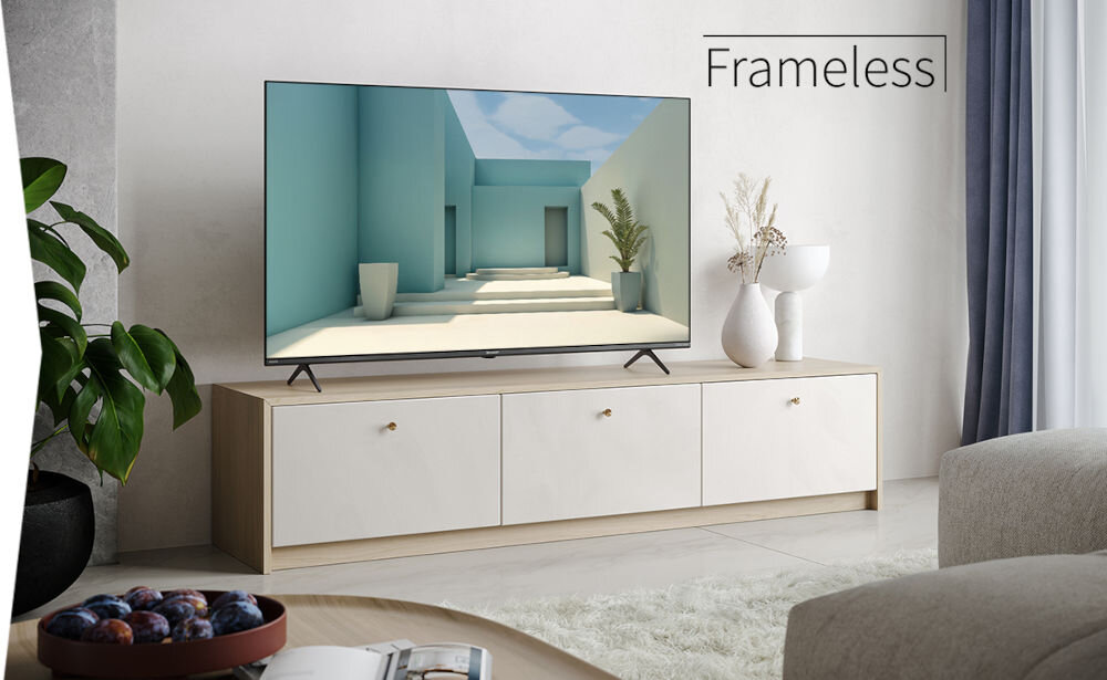 Telewizor SHARP 55GM6141E - wygląd bez ramek, Elegancki, bezramkowy design, telewizor stojący na komodzie w salonie