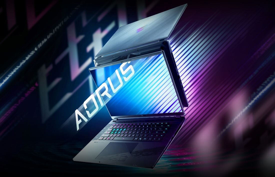 Laptop gamingowy GIGABYTE AORUS unosi się w futurystycznej scenie, prezentując podświetlaną klawiaturę i dynamiczny ekran dla graczy.  
