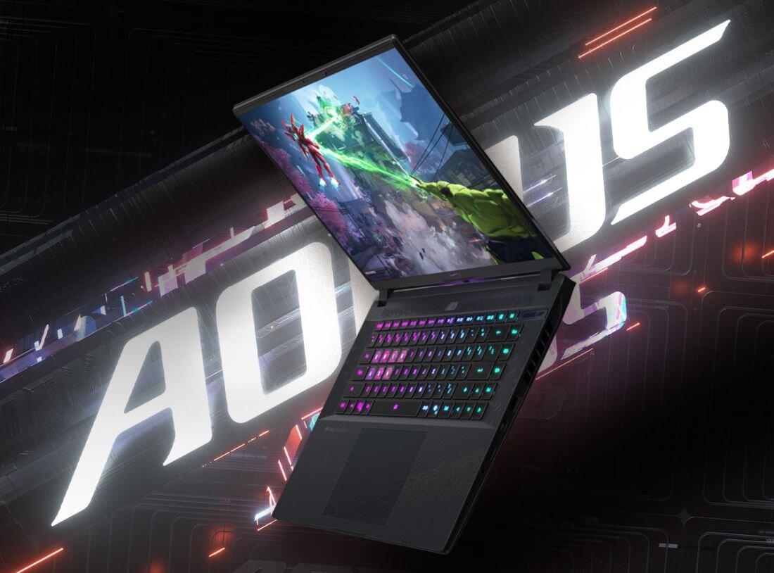 Laptop gamingowy GIGABYTE AORUS z podświetlaną klawiaturą prezentuje grafikę akcji na tle dynamicznego napisu AORUS. - Wi-Fi 7   