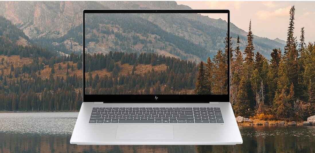 Laptop HP OmniBook w srebrnej obudowie na tle malowniczego krajobrazu z jeziorem i górami, ekran FHD prezentuje wysoką jakość obrazu i żywe kolory natury. - 17.3-calowy ekran dotykowy Full HD