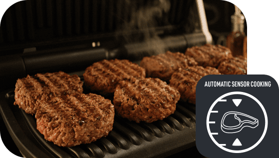 Na grillu elektrycznym znajduje się kilka grillowanych burgerów. Obok widoczna jest ikona z napisem \'AUTOMATIC SENSOR COOKING\' oraz symbolem mięsa i wskaźnikiem.