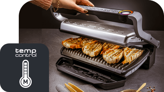 Na obrazie widoczny jest otwarty grill elektryczny z kilkoma kawałkami pieczywa na ruszcie. Obok znajduje się ikona z napisem \'temp control\' i symbolem termometru z literą \'M\'.