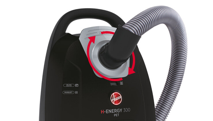 Odkurzacz z widocznym logo Hoover, oznaczeniem \'H-ENERGY 300 PET\' oraz podłączonym elastycznym wężem. Na obudowie znajdują się symbole wskazujące na funkcje odkurzacza.