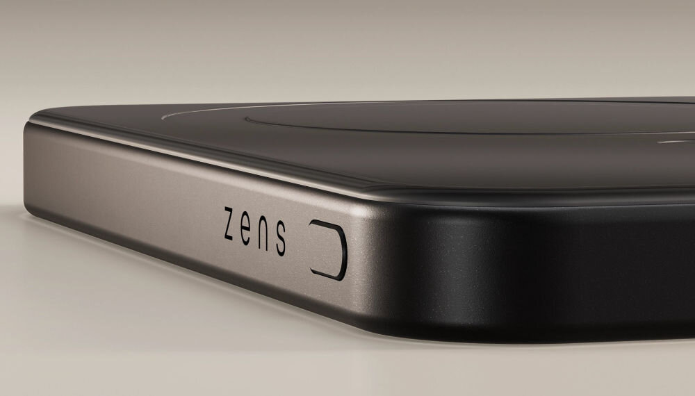 Czarny powerbank z zaokrąglonymi krawędziami, na którym widoczne jest logo \'zens\'.