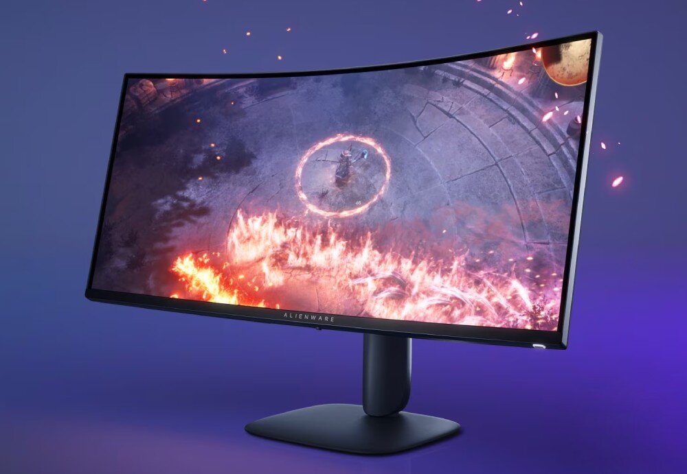 Monitor DELL Alienware AW3425DWM Monitor ukazujący postać stojącą wewnątrz ognistego okręgu w grze wideo na fioletowym tle z dynamicznymi efektami cząsteczkowymi