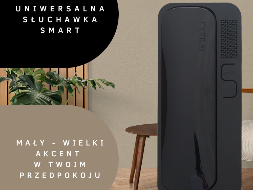 Na obrazie widoczny jest czarny unifon z napisem \'CYFRAL\' na tle wnętrza z rośliną i stołem. Tekst na obrazie: \'UNIWERSALNA SŁUCHAWKA SMART\' oraz \'MAŁY - WIELKI AKCENT W TWOIM PRZEDPOKOJU\'.