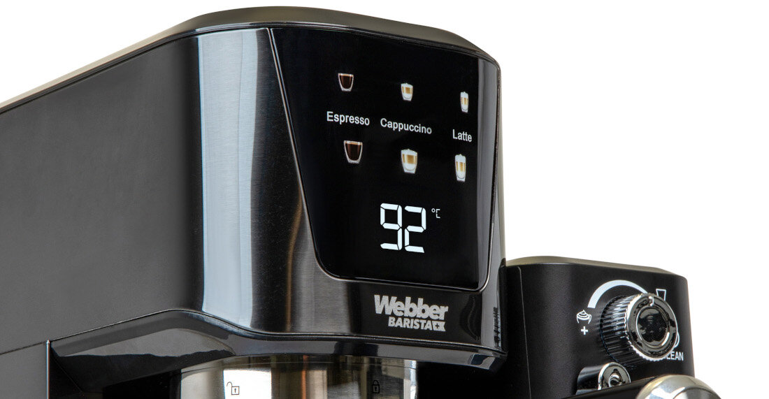 Czarny ekspres do kawy z wyświetlaczem pokazującym temperaturę 92°C. Na panelu widoczne są ikony i napisy: Espresso, Cappuccino, Latte oraz logo Webber Barista.