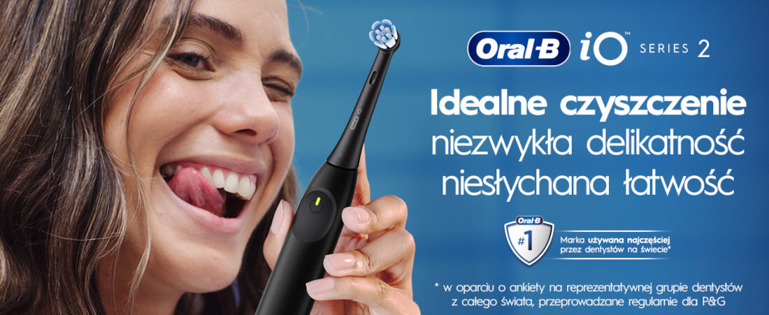 Obraz przedstawia osobę trzymającą czarną szczoteczkę magnetyczną Oral-B iO Series 2. Na niebieskim tle widoczny jest tekst: \'Idealne czyszczenie, niezwykła delikatność, niesłychana łatwość\'.