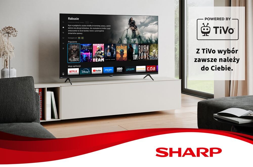 Telewizor SHARP 55HM5745E TiVo QLED bogactwo kolorów spersonalizowana rozrywka, telewizor stojący na komodzie w pomieszczeniu