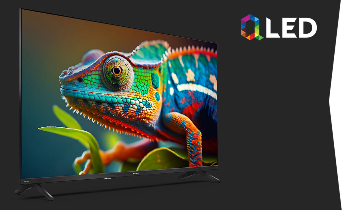 Telewizor SHARP 40HF3765E QLED Quantum Dot LCD LED bogate kolory kontrast, telewizor od frotnu stojący na ciemnym tle