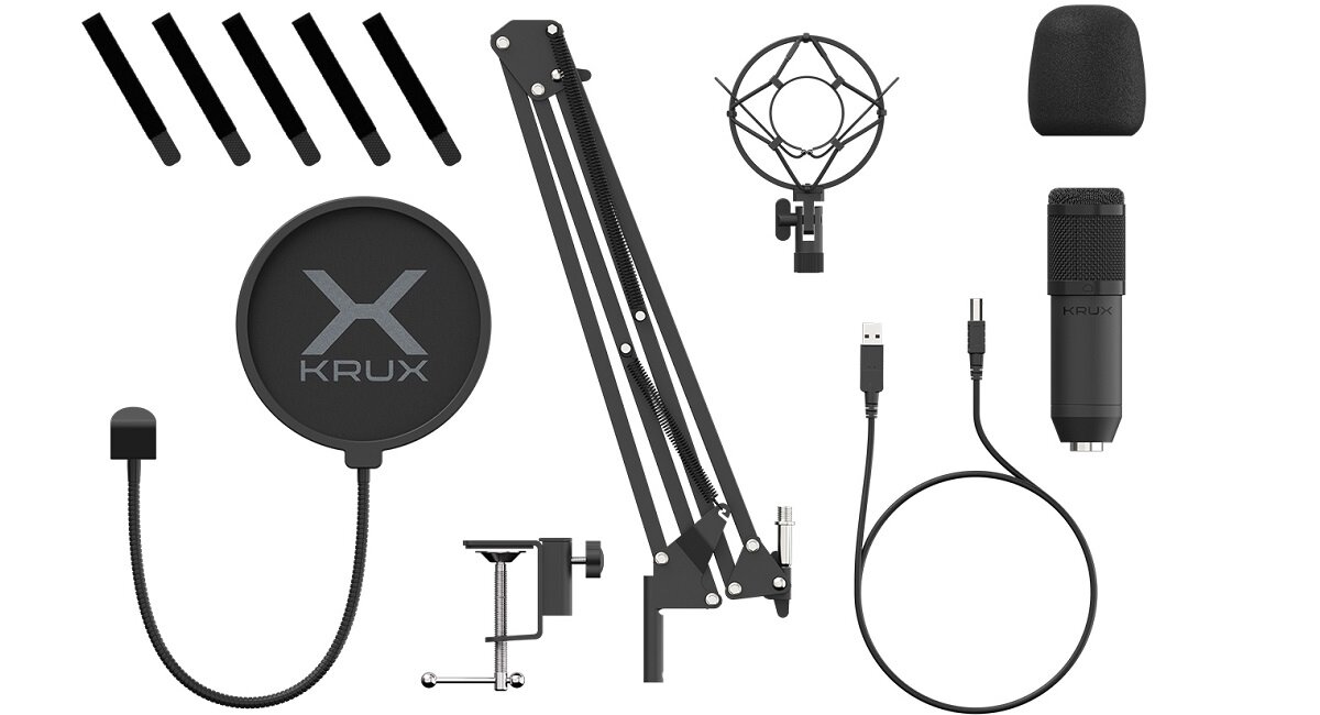 Na obrazie znajduje się zestaw do mikrofonu, w tym ramię montażowe, pop filtr z logo \'KRUX\', uchwyt antywibracyjny, osłona przeciwwietrzna, mikrofon, kabel USB oraz elementy montażowe.