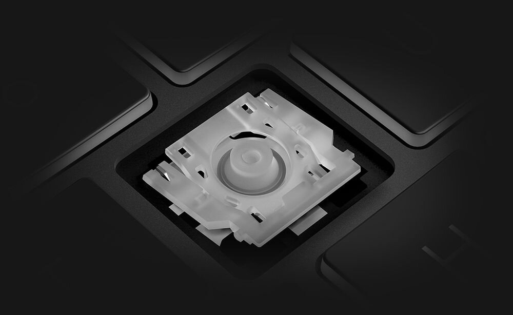 Zbliżenie białego przełącznika mechanicznego klawiatury ASUS ErgoSense w czarnej obudowie z widocznymi krawędziami klawiszy - Klawiatura ErgoSense Cicha praca