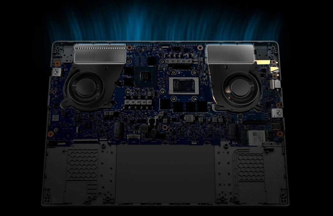 Wnętrze laptopa ASUS TUF Gaming z dwoma dużymi wentylatorami i zaawansowanym układem chłodzenia, widok na płytę główną i podzespoły, podświetlenie symbolizujące odprowadzanie ciepła. -  chłodzenie, Wentylatory Arc Flow 2. generacji 